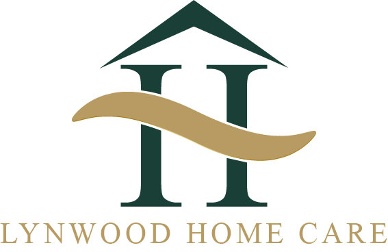 Stylized logo of Lynwood Home Care featuring a green house icon above golden waves and the text "LYNWOOD HOME CARE" in a modern font.